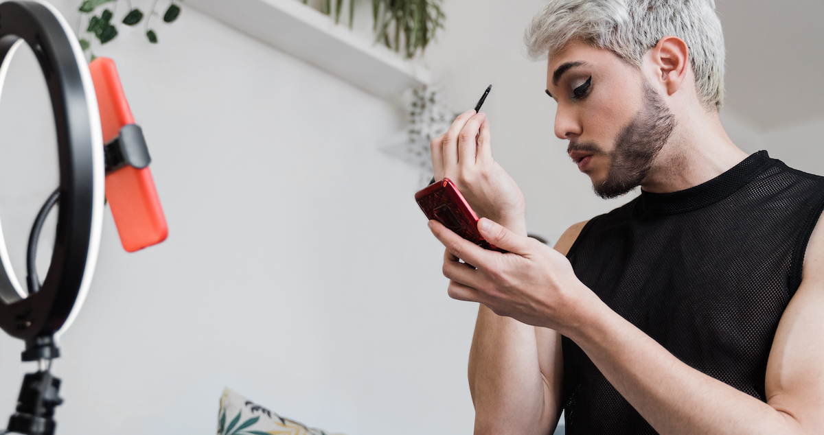 Market your business: image of drag queen doing makeup on TikTok