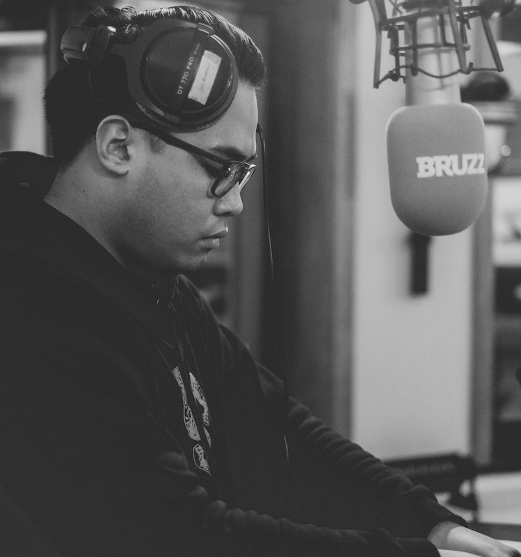 documentary narration: voice actor in front of microphone